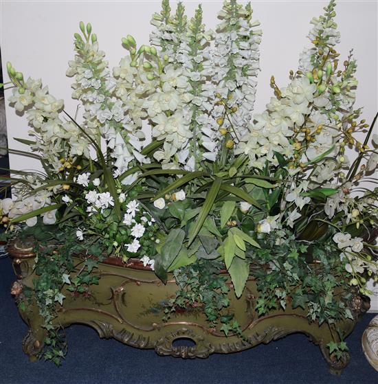 An Italian green and gilt jardiniere with silk flowers W.155cm